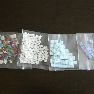 4 packages of Tila beads + bonus seed beads